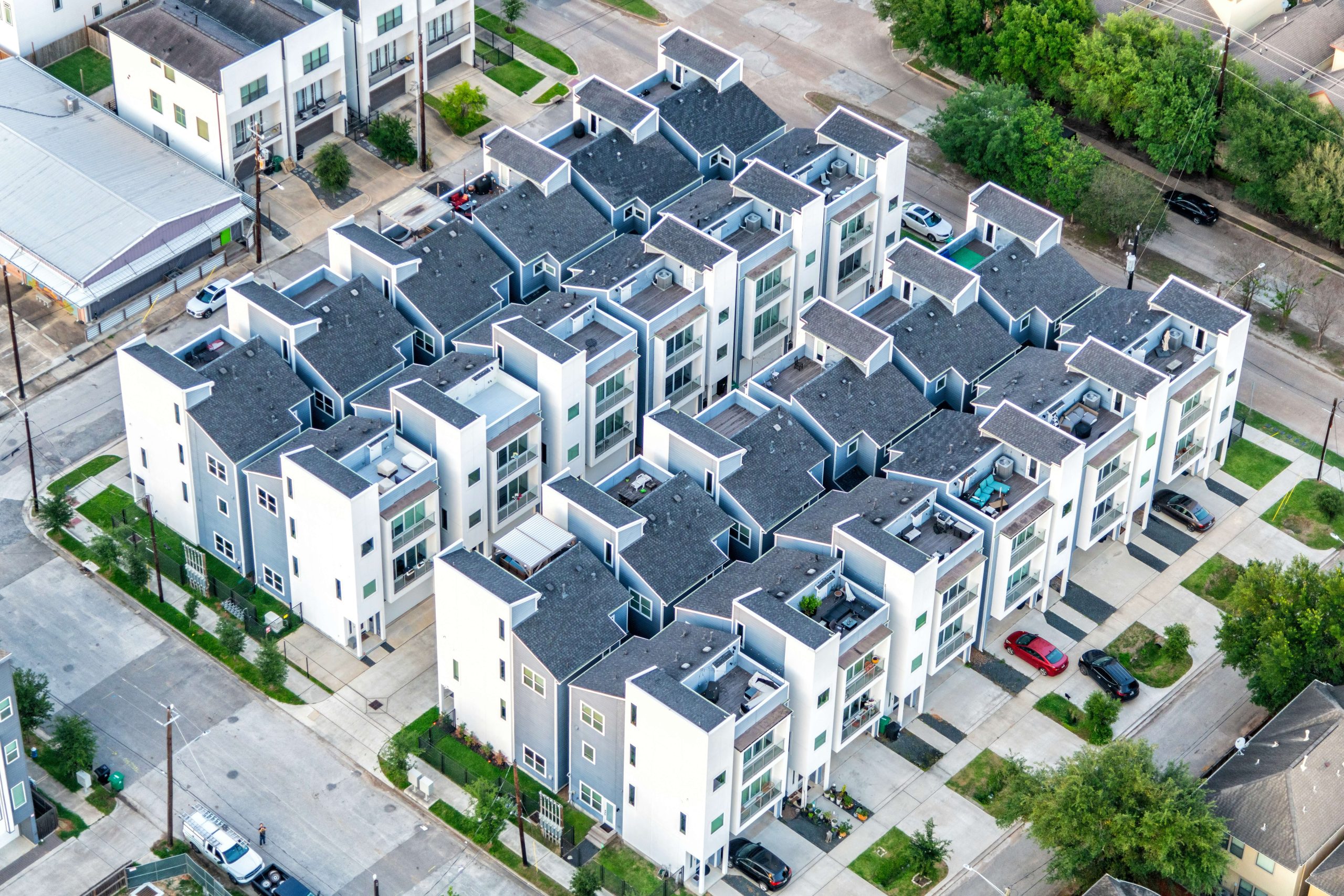 Aerial view of modern townhomes illustrating property financing options in a construction loan vs. DSCR loan comparison.